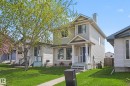 Two-story residence featuring light-colored siding and a covered front porch with white columns - 2123 36 Avenue, Edmonton, AB  - Outdoor With Facade 