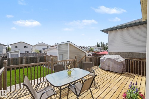 Expansive wood deck with a full wood railing and privacy fencing - 2123 36 Avenue, Edmonton, AB - Outdoor With Deck Patio Veranda With Exterior