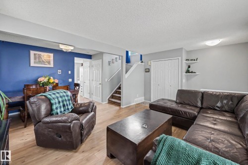 Open-concept living space featuring light wood-finish flooring throughout - 2123 36 Avenue, Edmonton, AB - Indoor Photo Showing Living Room