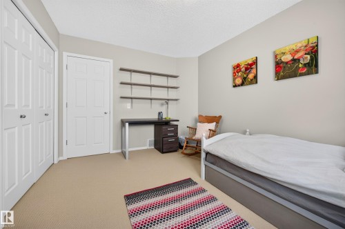 Neutral-toned walls and carpeted flooring - 1310 82 Street, Edmonton, AB 