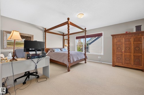 Spacious room featuring neutral carpeting and light gray walls - 1310 82 Street, Edmonton, AB 