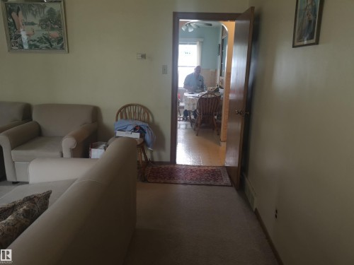 View from front entrance to kitchen. Living room on left - 8751 76 Avenue Nw, Edmonton, AB 