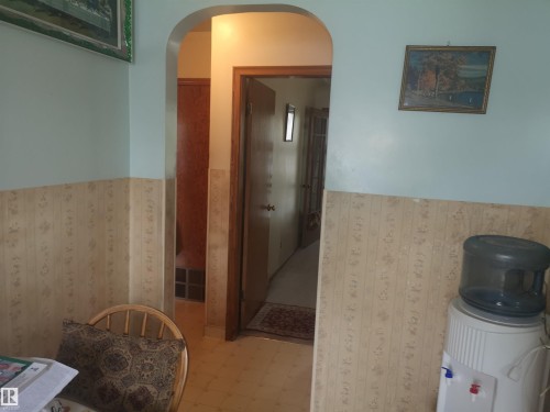 View from kitchen to hall to living room. Bedrooms and bath on left.l - 8751 76 Avenue Nw, Edmonton, AB 