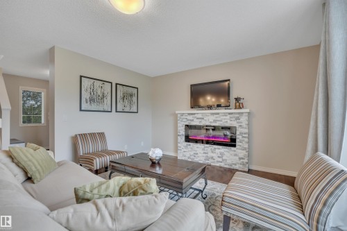 173 Reichert, Beaumont, AB - Indoor Photo Showing Living Room With Fireplace