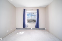 Neutral-toned walls and light-colored carpet create a bright interior - 