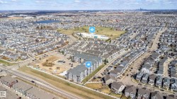 Aerial perspective showcasing multi-story residential buildings surrounded by a developed neighborhood - 