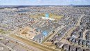 Aerial perspective showcasing multi-story residential buildings surrounded by a developed neighborhood - 421 4008 Savaryn Drive, Edmonton, AB  - Outdoor With View 