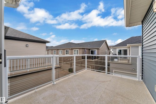 Outdoor patio featuring a concrete surface and aluminum-framed glass railing - 144 Sunwapta Way, Edmonton, AB 
