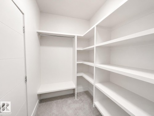 Custom closet system featuring extensive shelving and hanging rods - 415 42 Street, Edmonton, AB 