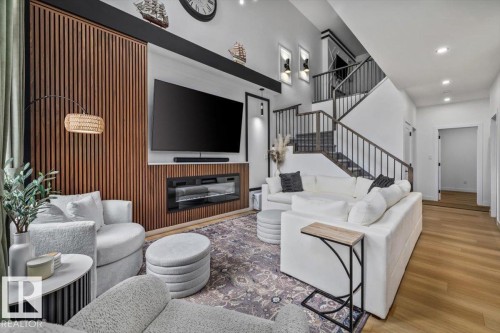 3616 Triomphe Boulevard, Beaumont, AB - Indoor Photo Showing Living Room With Fireplace