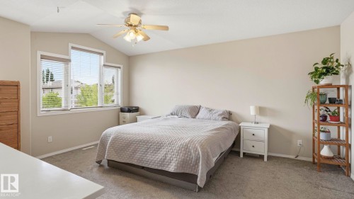 Vaulted ceiling with a ceiling fan light fixture - 6105 52 Avenue, Beaumont, AB 