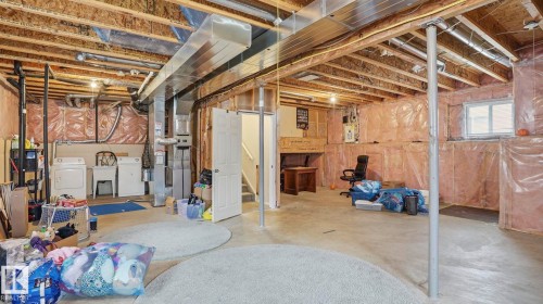 Spacious unfinished basement offering extensive customization potential - 6105 52 Avenue, Beaumont, AB 