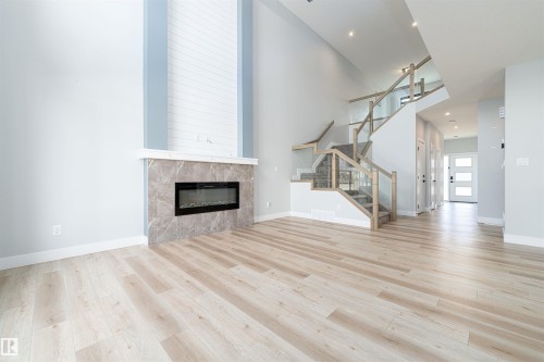 Bright living space featuring light wood-finish flooring - 17320 9 Avenue, Edmonton, AB 