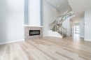 Bright living space featuring light wood-finish flooring - 17320 9 Avenue, Edmonton, AB 