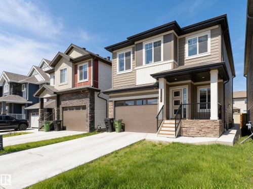 Light wood-finish flooring complements the neutral wall tones - Edmonton, AB 