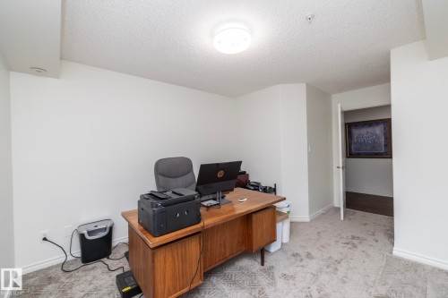 Carpeted room with white painted walls and a textured ceiling - 111 182 Haddow Close, Edmonton, AB 