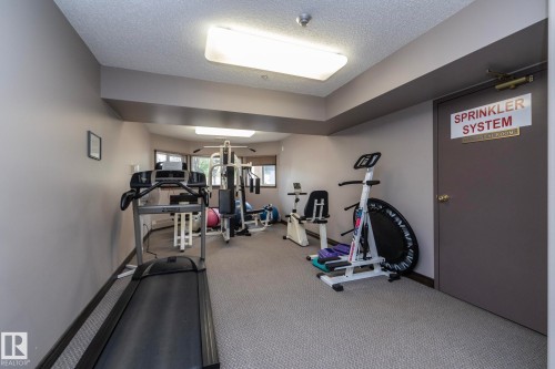 Interior space featuring neutral-toned walls, recessed lighting, and grey carpeting - 111 182 Haddow Close, Edmonton, AB 