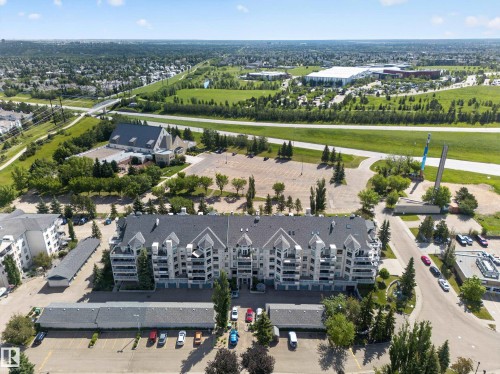 Multi-story residential building with gabled roofs and individual balconies - 111 182 Haddow Close, Edmonton, AB 
