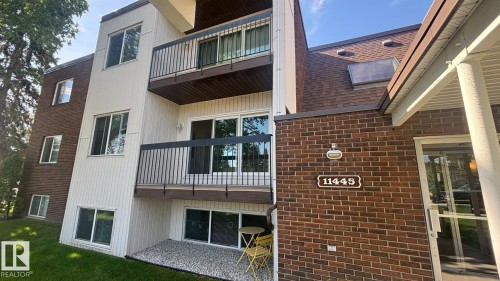 Multi-story residential building featuring brick and vertical siding - 203 11445 41 Avenue, Edmonton, AB 
