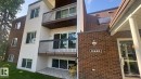 Multi-story residential building featuring brick and vertical siding - 203 11445 41 Avenue, Edmonton, AB 
