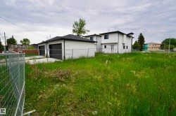 Expansive grassy lot offering development potential, from the back right - 