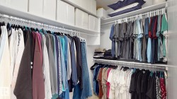 Custom closet system featuring multiple hanging rods and integrated shelving - 