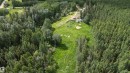 Expansive wooded property featuring a cleared building site, existing structures, and a gravel access road - 58403 Rr 60, Rural Barrhead County, AB  - Outdoor With View 