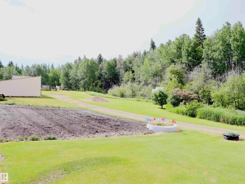 Expansive green lawn with a prepared garden plot - 58403 Rr 60, Rural Barrhead County, AB - Outdoor With View