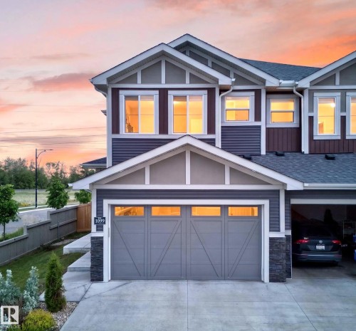 Modern multi-level exterior with varied siding textures and accent stone - 1099 Eaton Road, Edmonton, AB 