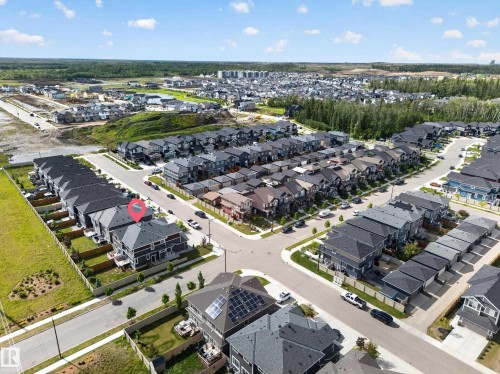Modern residential development featuring a structured street grid, uniform housing styles, and extensive green spaces - 1099 Eaton Road, Edmonton, AB 