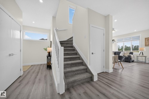 Staircase with carpeted treads and white risers - 1099 Eaton Road, Edmonton, AB 