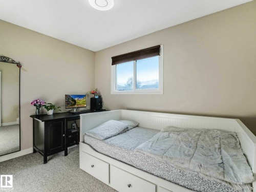 Bright room featuring neutral wall tones and textured carpeting - 9207 169 Street, Edmonton, AB - Indoor Photo Showing Bedroom