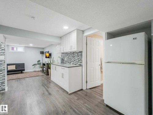 Open concept living area with light wood-finish flooring - 9207 169 Street, Edmonton, AB - Indoor