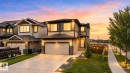 Two-story residence featuring light-colored siding with dark trim accents - 9628 221 Street, Edmonton, AB 
