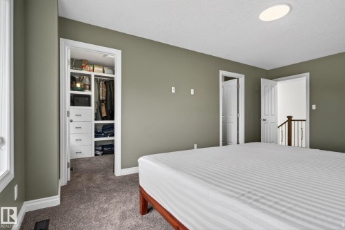 Bedroom featuring neutral wall paint, white trim, and gray carpet - 9628 221 Street, Edmonton, AB 