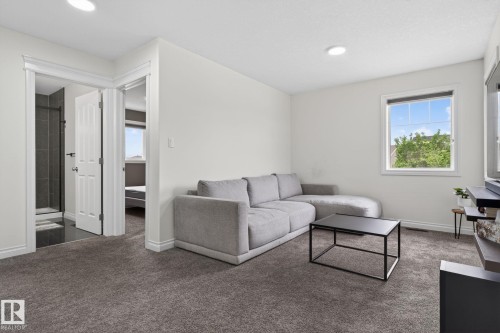 Carpeted recreation area with light neutral walls and recessed lighting - 9628 221 Street, Edmonton, AB 