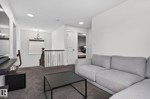 Spacious upper-level area featuring dark gray carpeting and recessed lighting - 9628 221 Street, Edmonton, AB 