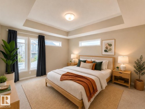 Recessed ceiling detail and neutral wall tones enhance this spacious room - 22519 96 Avenue, Edmonton, AB 