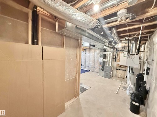 Unfinished basement space with exposed wooden joists and concrete flooring - 22519 96 Avenue, Edmonton, AB 