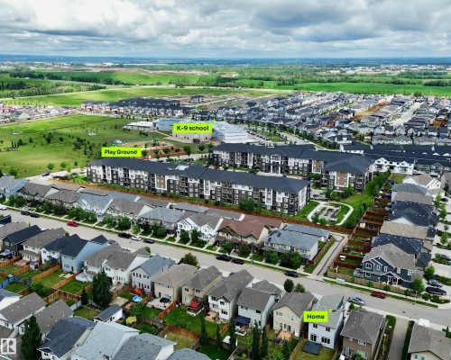 Aerial perspective showcasing the residential neighborhood with single-family homes and multi-story apartment buildings - 22519 96 Avenue, Edmonton, AB 