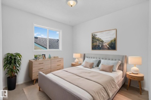 Room featuring light-toned walls and wood-finish flooring - 6225 159A Avenue, Edmonton, AB 