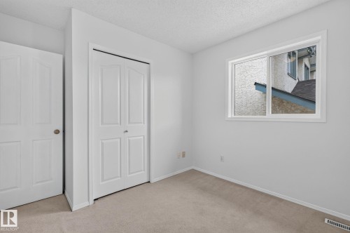 Neutral-toned carpeting paired with light walls - 6225 159A Avenue, Edmonton, AB 