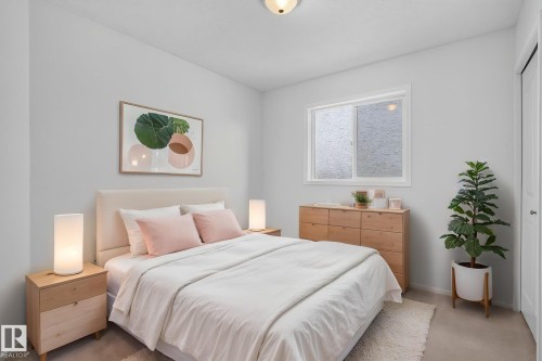 Bedroom featuring light-colored walls and carpet flooring - 6225 159A Avenue, Edmonton, AB 