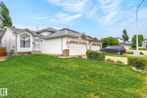 Exterior featuring white vinyl siding and a gray shingle roof - 6225 159A Avenue, Edmonton, AB 