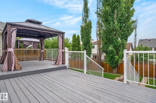 Spacious outdoor deck featuring gray wood-finish flooring - 6225 159A Avenue, Edmonton, AB 