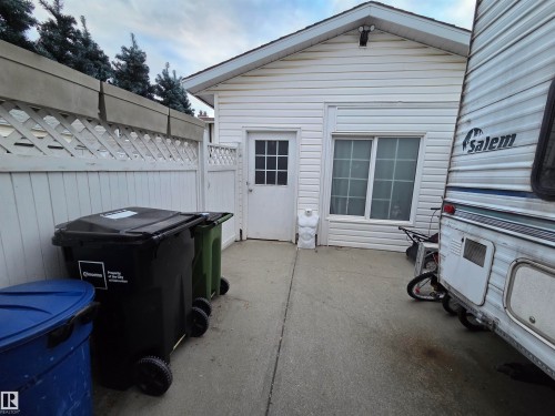 Detached auxiliary building with white horizontal siding and a gable roofline - 2514 149 Avenue, Edmonton, AB 