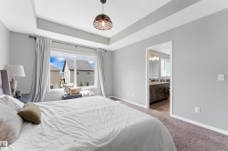 Recessed tray ceiling with a contemporary pendant light fixture - 