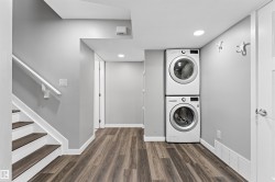 Dedicated laundry area featuring stacked appliances - 