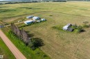 Expansive agricultural property featuring multiple structures and open fields - 534072 Range Road 85, Rural Two Hills County, AB 