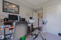 Carpeted room with light gray walls and white trim - 